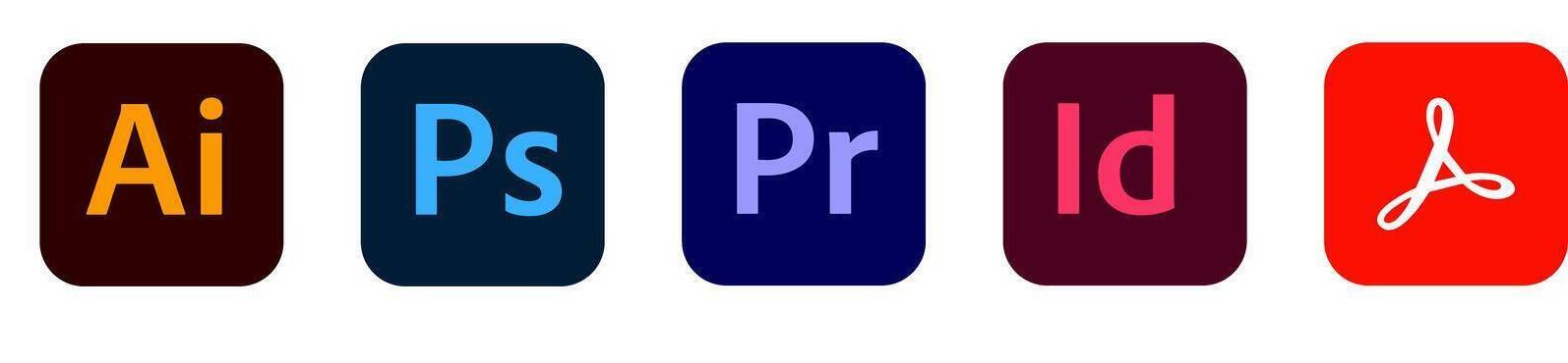 Ikony programów Adobe Photoshop, Illustrator i InDesign na profesjonalnym stanowisku graficznym w Akademii Komputerowej.